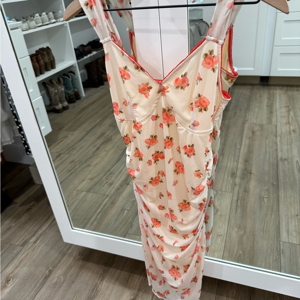 Floral fitted dress. Similar to the Beth Dutton dress